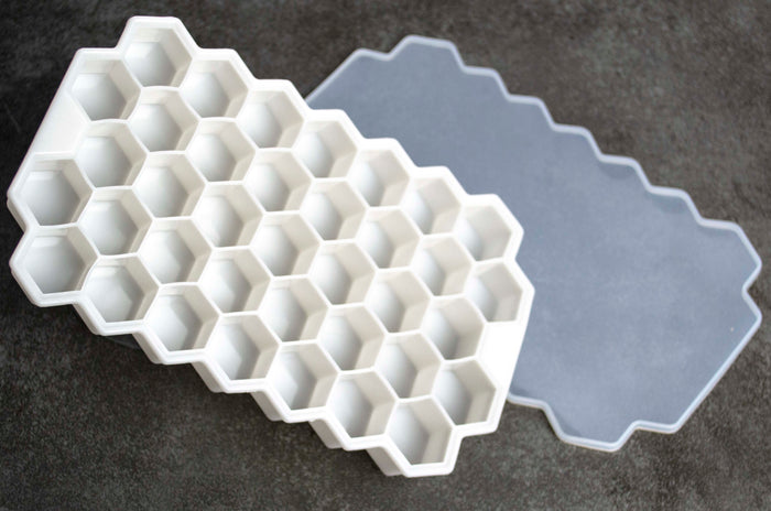 White Silicon ice tray with cover. Ice cubes are roughly 1/2" hexagons arranged in a 7 x 5 pattern.